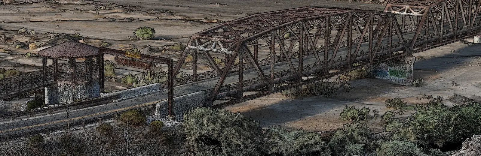 Dense colorized point cloud of the Gillespie Dam Bridge, a steel through truss carrying Old US 80 over the Gila River, with individual truss members and the roadway resolved.